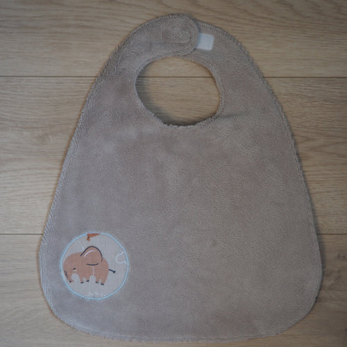 bavoir évolutif pour enfant réglable beige aux motifs d'éléphants