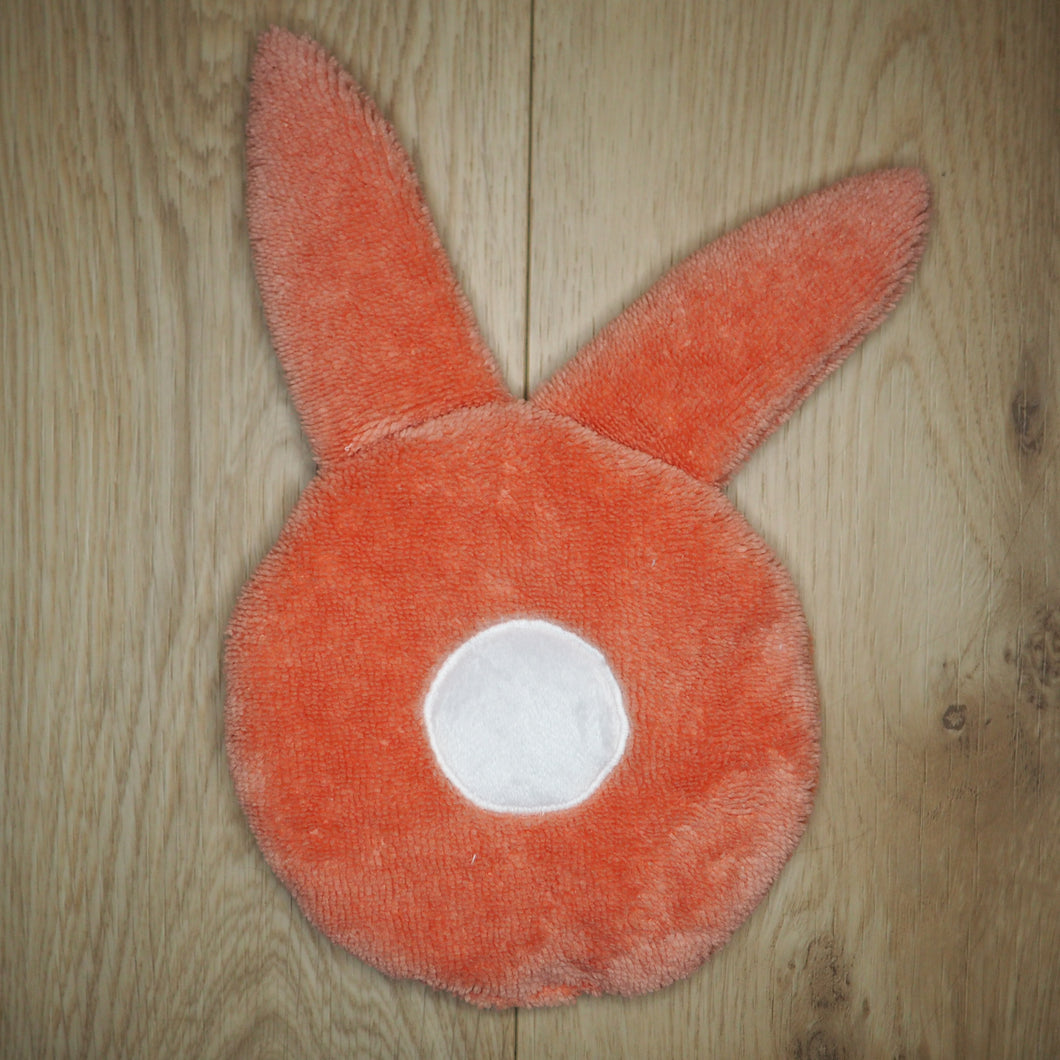 Doudou en forme de lapin rose et blanc, en éponge toute douce